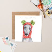 Load image into Gallery viewer, Greyhound in Wooly Hat Christmas card with Gold Foil - lil wabbit
