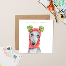 Load image into Gallery viewer, Greyhound in Wooly Hat Christmas card with Gold Foil - lil wabbit
